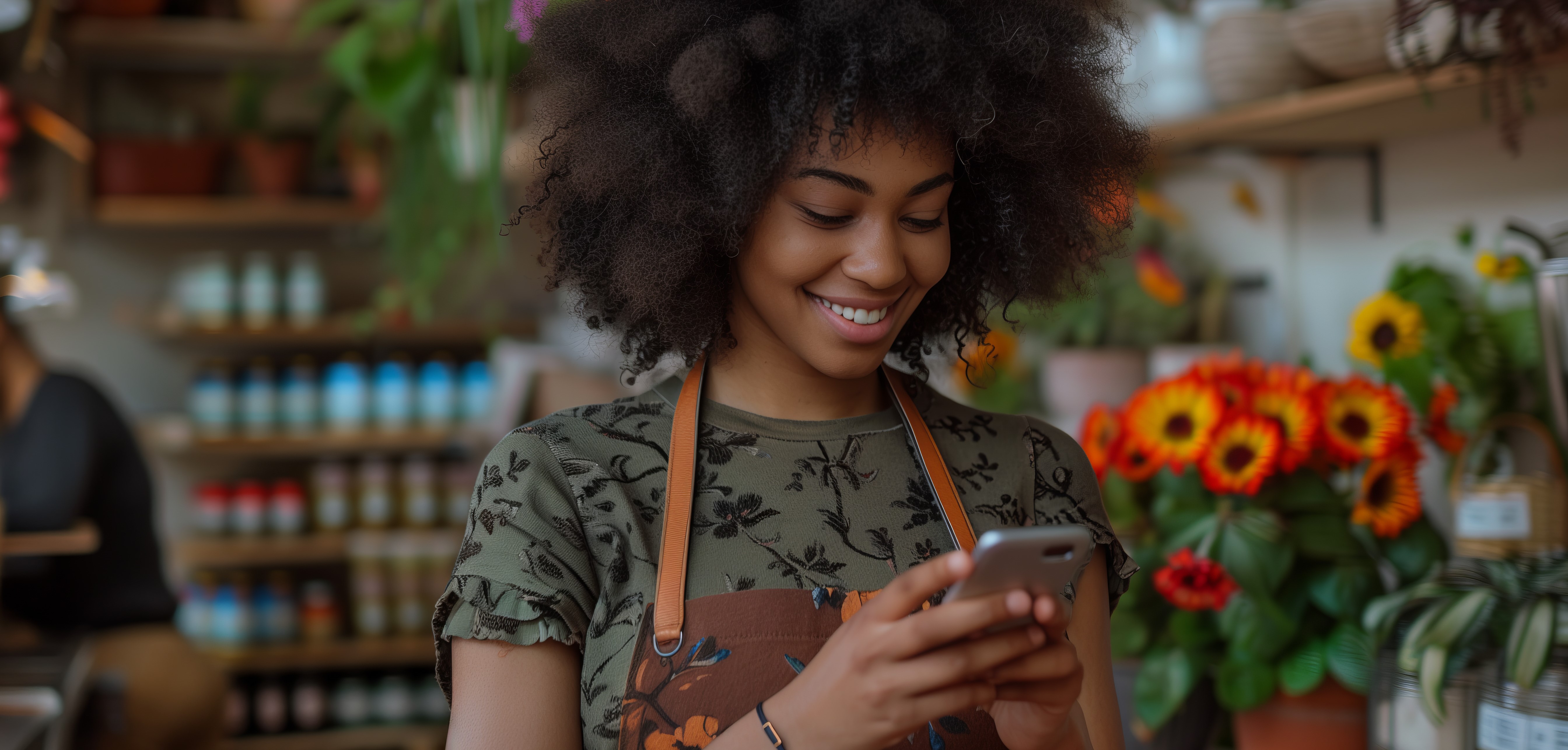 african-american-female-employee-looking-phone-cafe.jpg